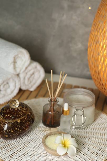 istock Composition with different spa products and plumeria flower on table 2195354027