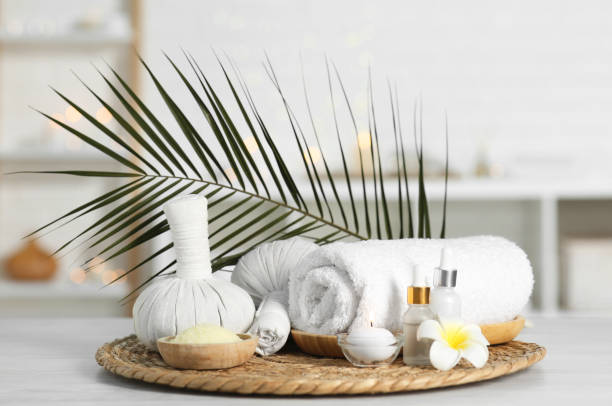 istock Composition with different spa products and plumeria flower on white table indoors 2195354036