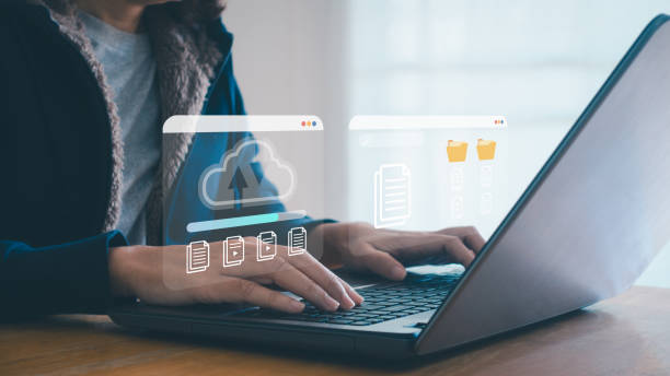 istock Document Management System. Businesswoman using laptop and dashboard for data management with cloud document system for transfer efficient digital file folder storage, online documentation technology. 2195354599