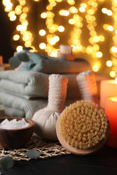 istock Beautiful composition with different spa products on table against blurred lights 2195354659