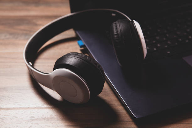 istock modern headphones and keyboard. 2195354913