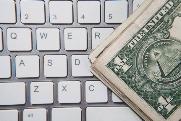 computer keyboard and dollar banknote, internet and business concept.