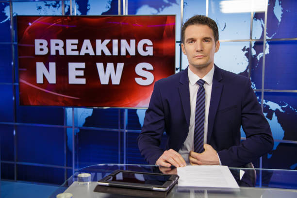 istock Breaking news male anchor 2195355275
