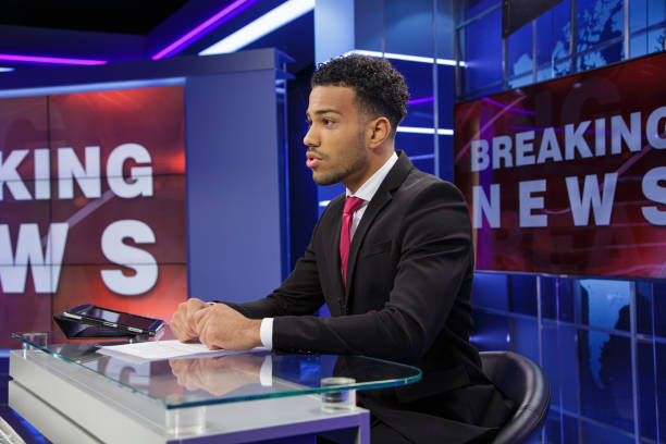 istock Breaking news male anchor 2195355326