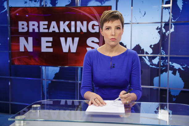 istock Breaking news female anchor 2195355343