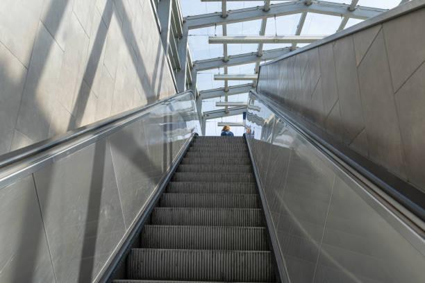 istock Escalator steps, moving staircase, empty metro elevator, electric stairway, metallic moving stairs 2195355900
