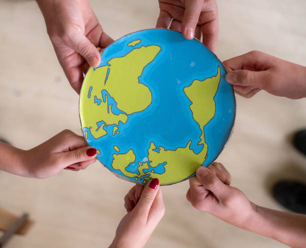 hands holding the planet recycling