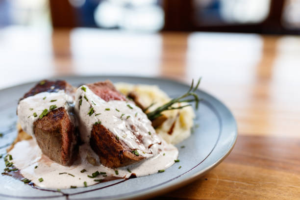 istock Gourmet Beef Steak With Creamy Sauce and Mashed Potatoes on Elegant Plate 2195356436