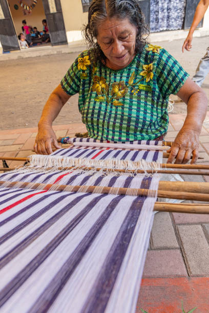 Santiago Atitlan, Solola, Guatemala. March 13, 2024. Guatemalan woman weaving on a traditional loom.