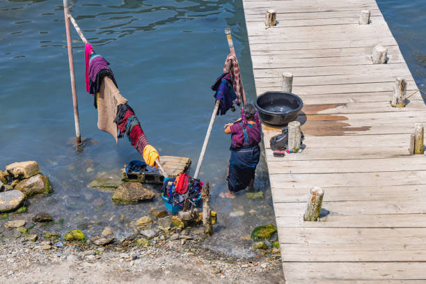 San Antonio Palopo, Solola, Guatemala. March 14, 2024. Women washing clothes in Lake Atitlan.