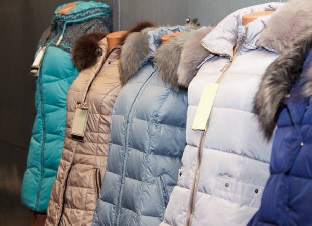 istock Winter jackets on mannequins with fur collars on display 2195361563