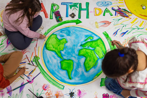 istock Teacher and Kids Creating Earth Day Poster 2195362484