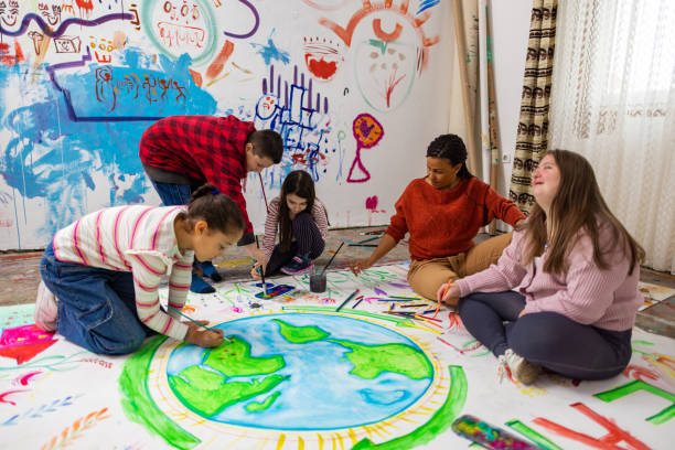 istock Smiling Children Drawing for Earth Day 2195362507