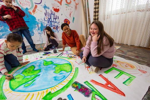 istock Happy Kids Painting the Earth 2195362601
