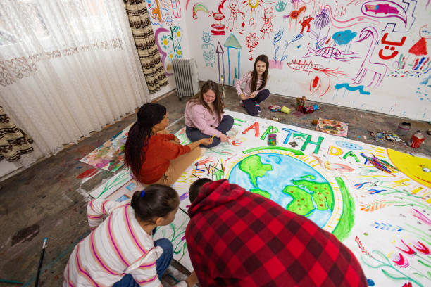 istock Teacher Leads Earth Day Art Project 2195362902