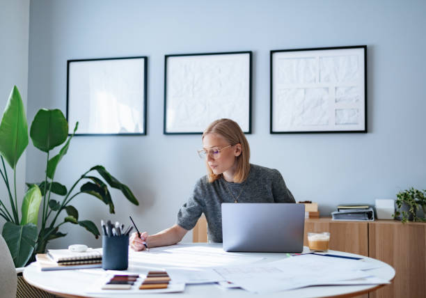 Young Businesswoman Working on a Creative Project in a Home Office