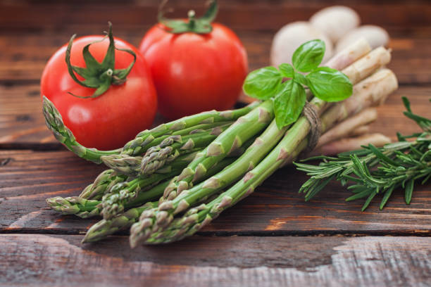 Assortment of fresh vegetables on kitchen table. Variety of organic vegetables on kitchen coutner with copy space.