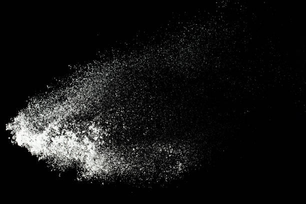 istock Fluffy White snow splash flying or throwing in mid air. Snowfall on Black background isolated. Snow dust element falling over dark night 2195372050