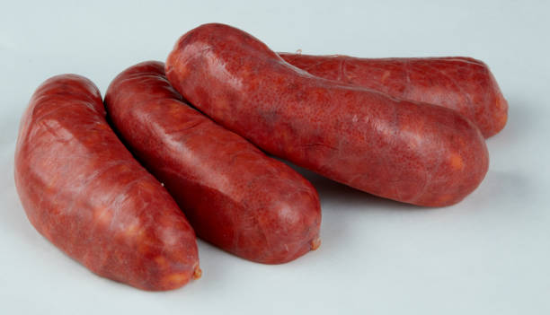 istock smoked sausage isolated nature background with clipping path 2195379069