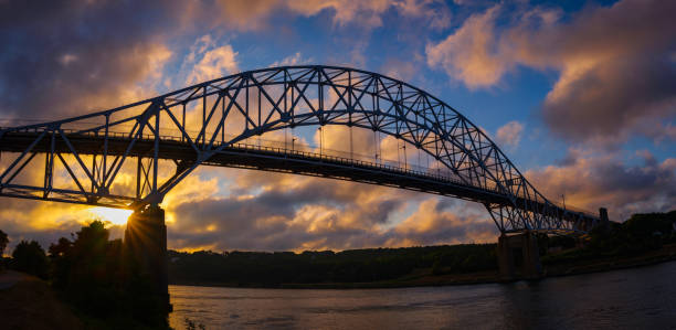 istock Dramatic Sunset Cloudscape over the Bourne Bridge at the Cape Cod Canal in Massachusetts, USA 2195380048