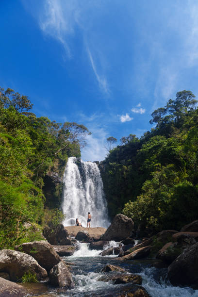 istock Couple in front of a waterfall 2195381453