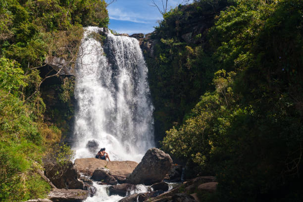 istock Couple in front of a waterfall 2195381454