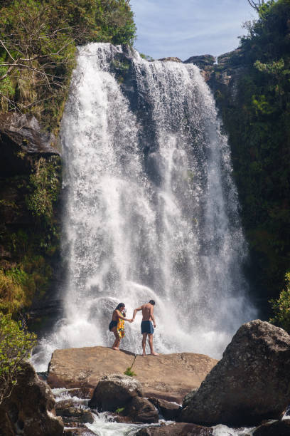 Couple in front of a waterfall