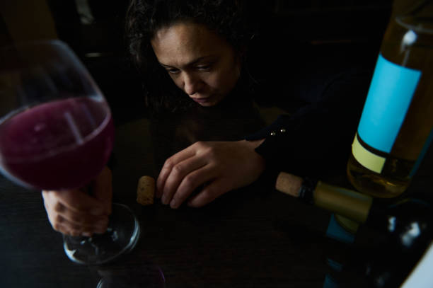 istock Contemplative woman highlighting issues of alcohol awareness and personal struggle 2195390571