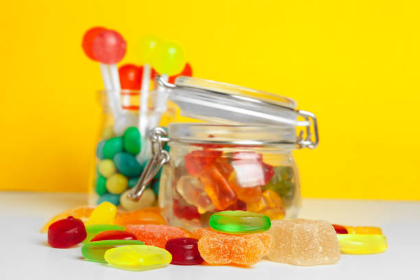 istock Bottles with sweet candies on table. creative photo. 2195391617