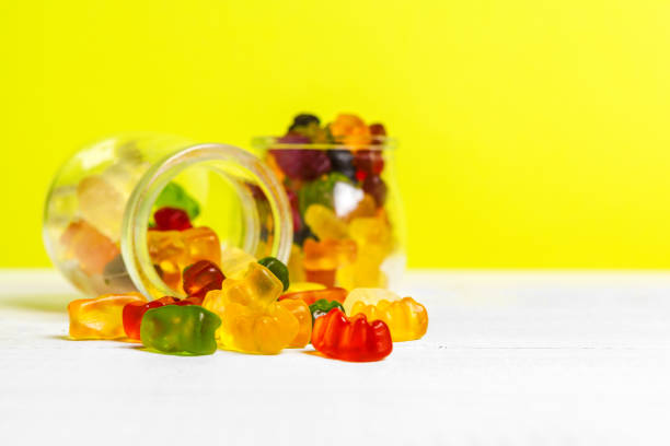 istock Bottles with sweet candies on table. creative photo. 2195391623