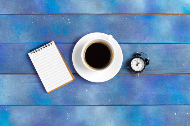 Mockup for check list, empty note paper with coffee cup on blue wood background. Office, writer or study concept