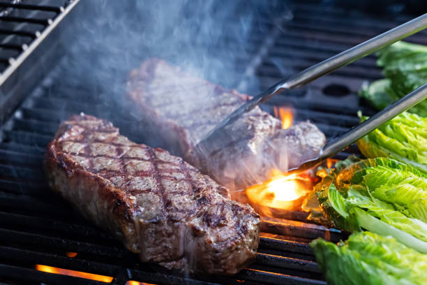 istock Grilling steak and romaine lettuce during a backyard barbecue 2195392376