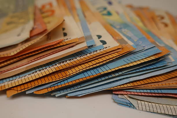 Close-up of colorful swiss franc banknotes stacked, suggesting concepts of saving, investment, and financial security