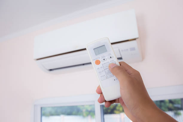 istock Close up hand and remote control air condition. 2195397122
