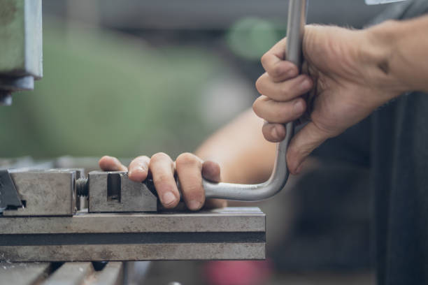 istock Man uses milling machine in machine shop 2195400227