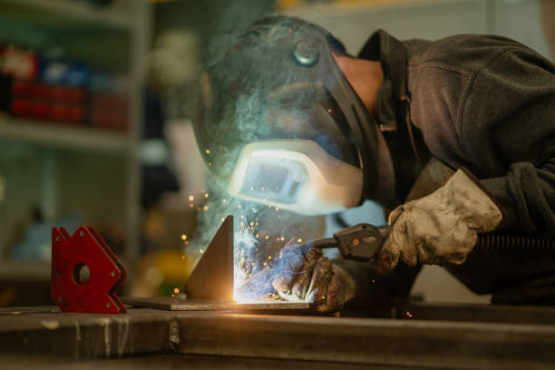 istock Welder works in machine shop 2195401291