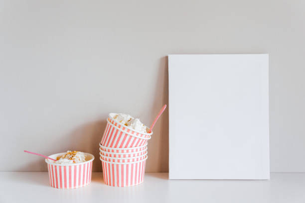 istock Stylish boxes with ice cream, white empty canva. Mockup for design, template 2195405872