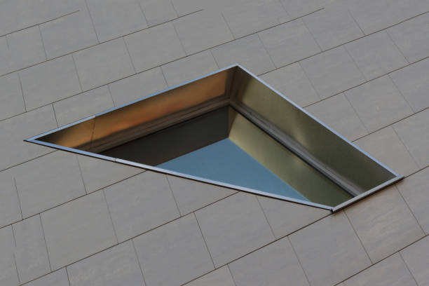 Original modern window on the wall of a city building.