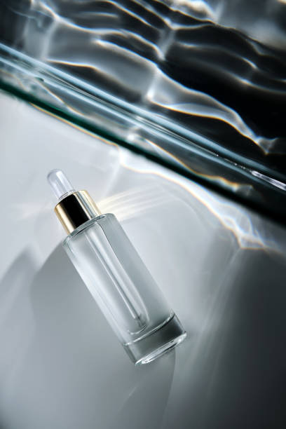 istock Bottle of face serum with a pipette with a beautiful highlight. 2195406646
