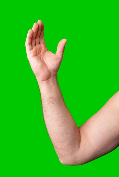 istock Arm raised in gesture against a bright green background 2195412331