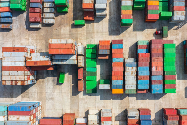 istock Stack of cargo containers in a terminal shipping yard, aerial top view. 2195412613