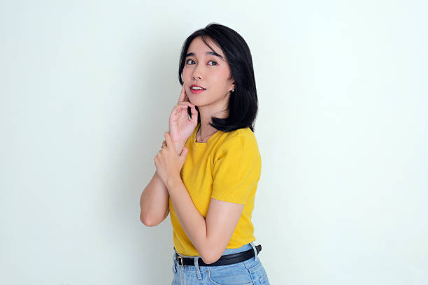 istock Asian young woman staring away thinking something 2195412690