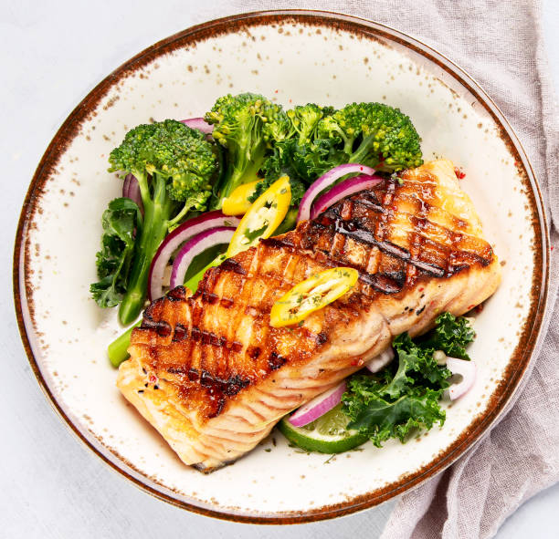 istock Baked salmon with vegetables 2195413070