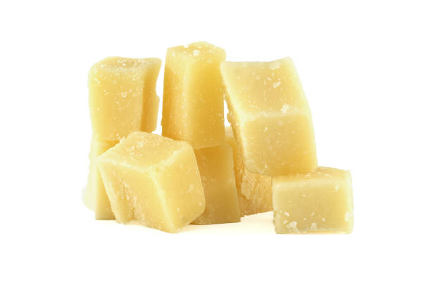 istock Parmesan cheese cubes forming a pile on white background 2195413270