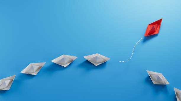 istock Business for new ideas creativity, innovative and solution concepts. Group of blue paper boat in one direction and one red paper boat pointing in different way.3D rendering on blue background. 2195416062