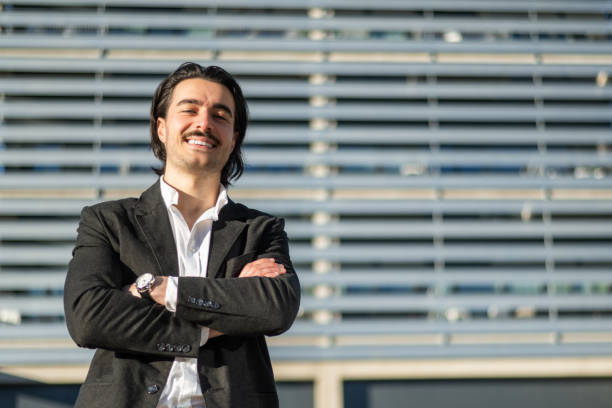 istock Confident And Smiling Insurance Agent Or Real Estate Consultant Outdoors, Representing Stability, Expertise, And Growth Opportunities In Finance, Property, And Business Leadership. 2195416690