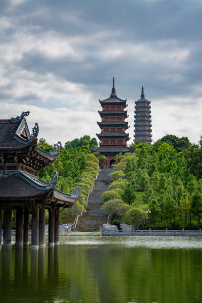 istock A tall pagoda and a shrine floating on a pond. 2195418338