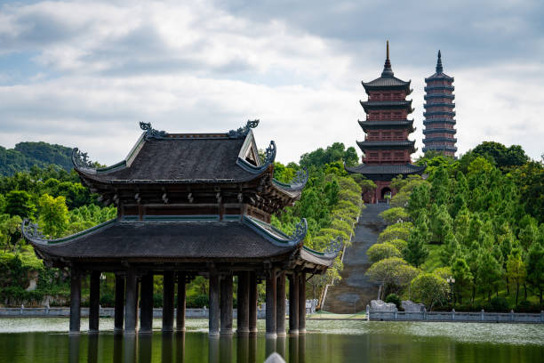 istock A tall pagoda and a shrine floating on a pond. 2195418349