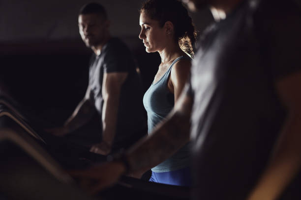 istock Young female athlete warming up on treadmill in a gym. 2195418669