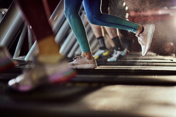 istock Unrecognizable athlete running on treadmill in a gym. 2195418767